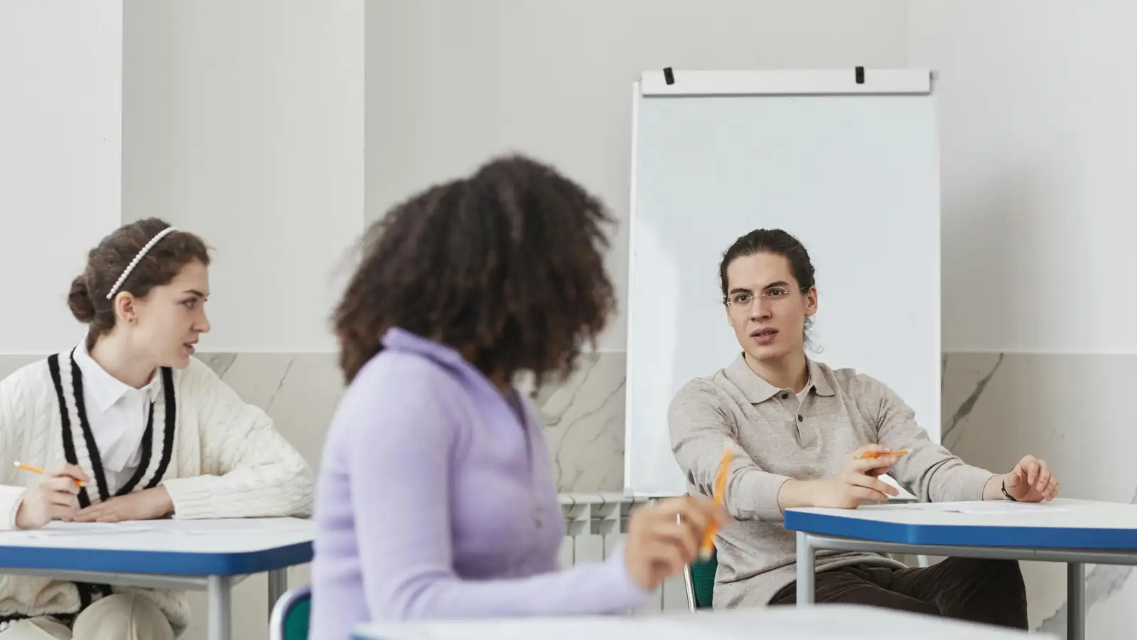 Students studying English together in a language school